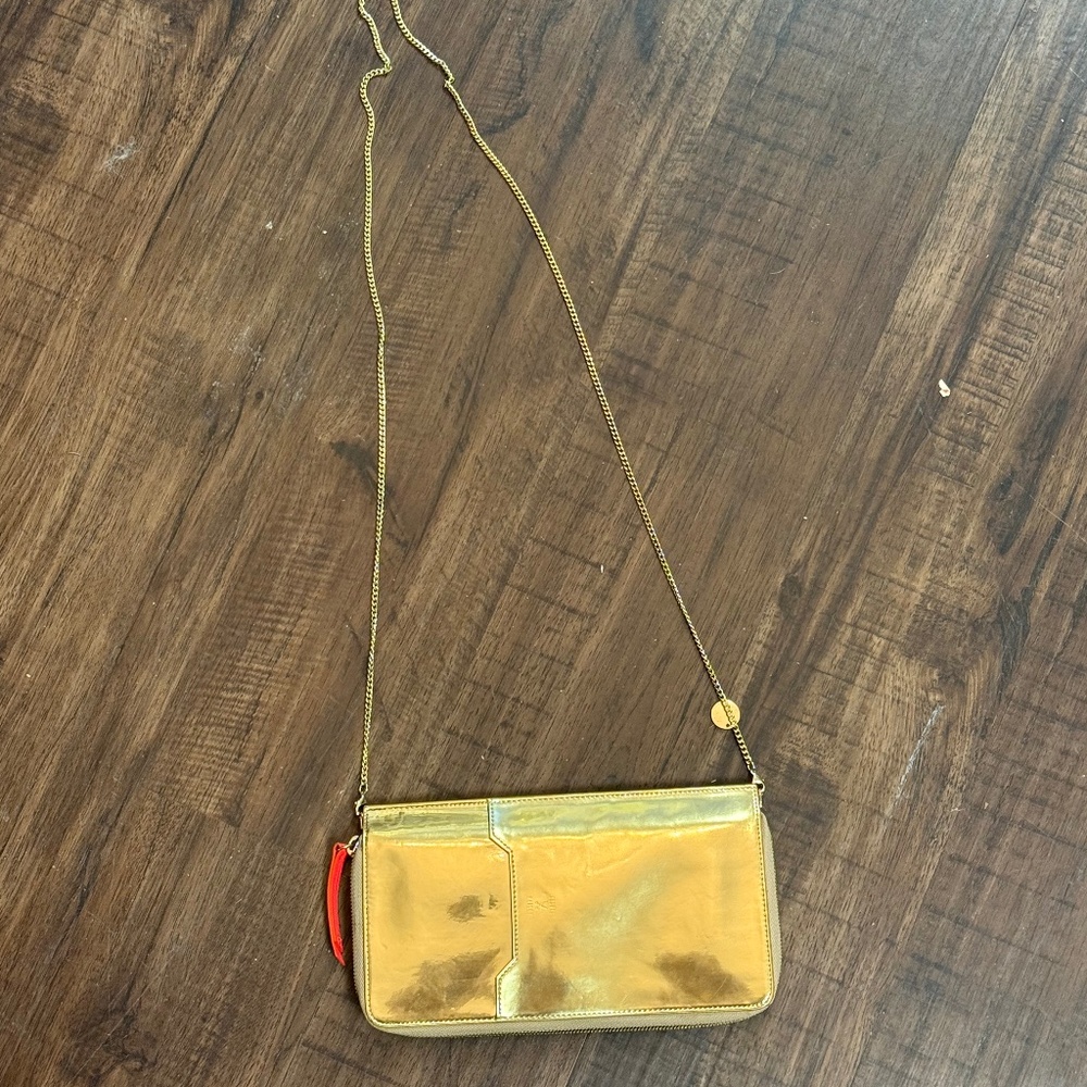 Joseph & Stacey gold clutch with red interior